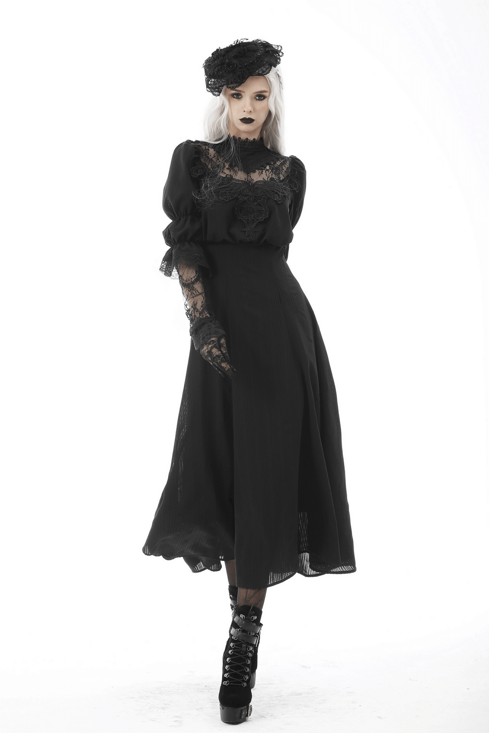 Elegant Gothic lace black dress with flowing skirt, sheer sleeves, and dark accessories for a hauntingly beautiful look.