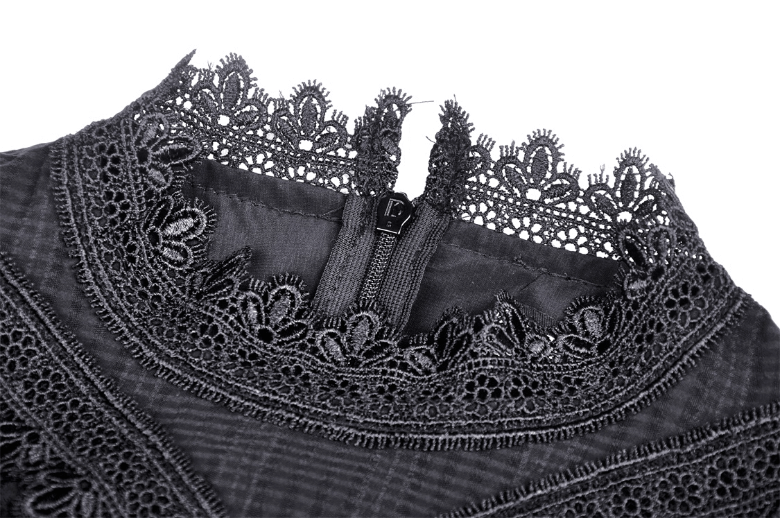 Close-up of intricate lace neckline and zipper detail on a Gothic bustier dress.