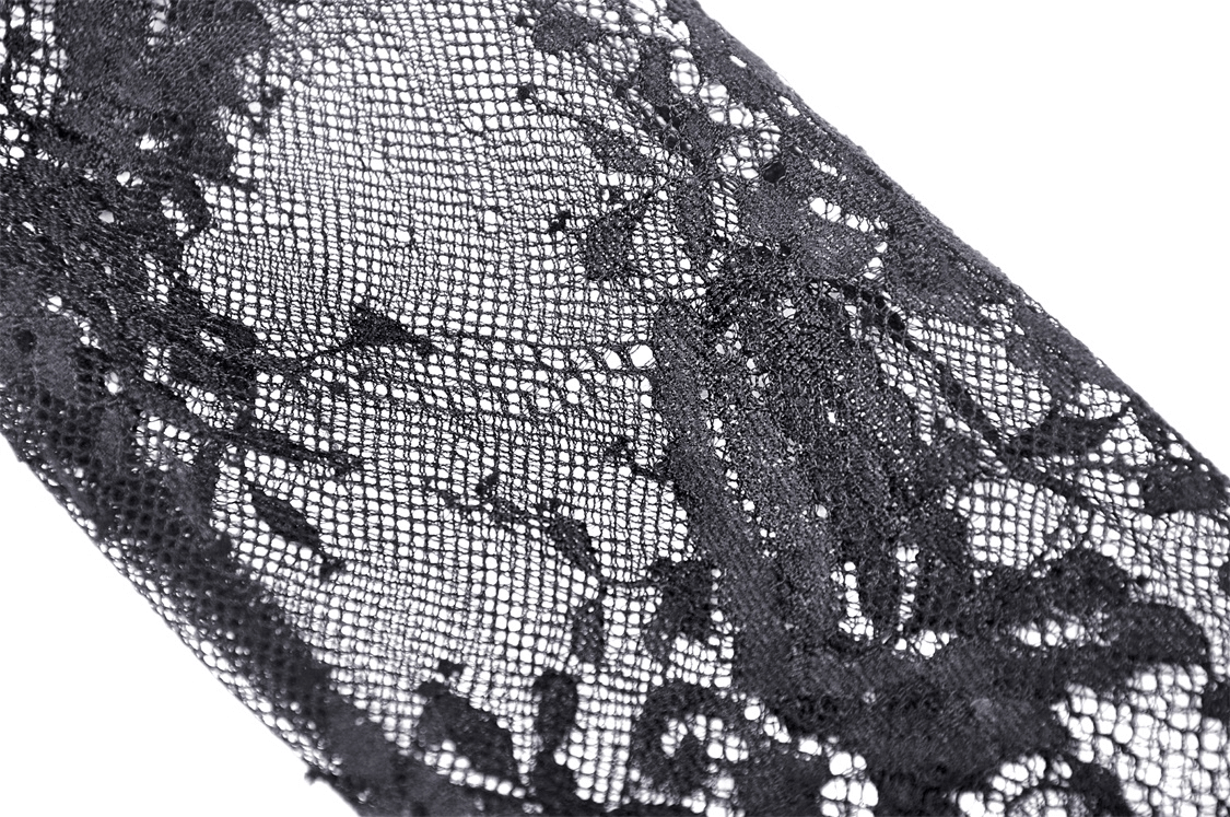 Close-up of intricate black lace fabric with floral patterns, perfect for gothic fashion and elegant dress designs.