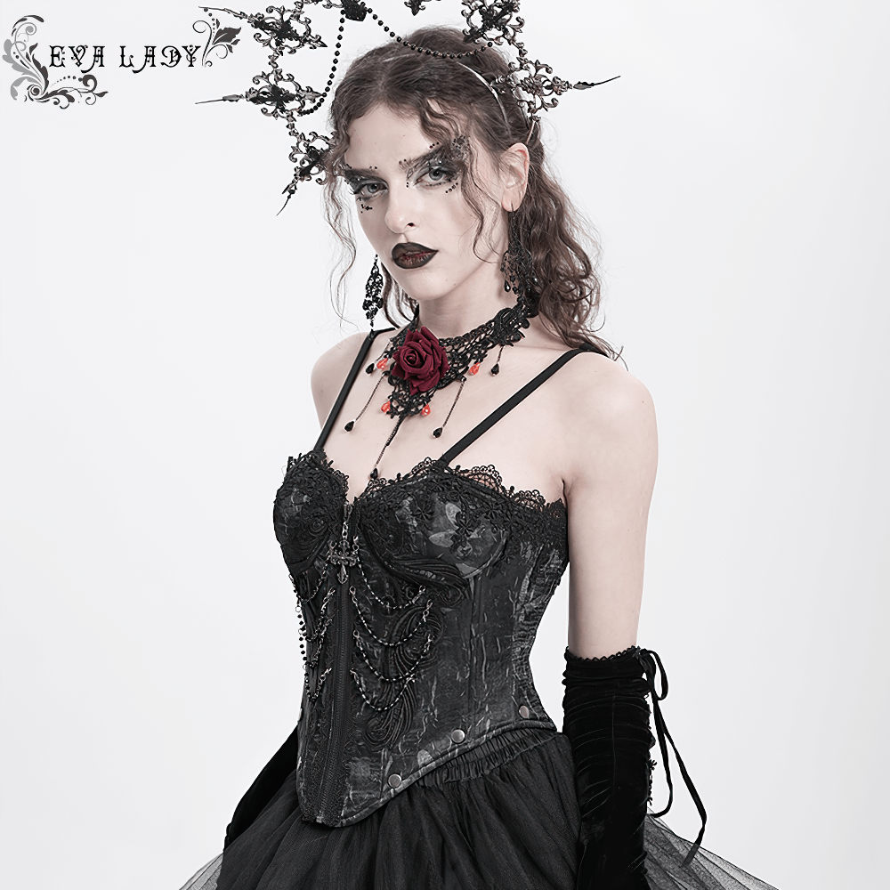 Elegant gothic lace corset with chains, worn by model in Victorian punk style, featuring cross pendant and tulle skirt.