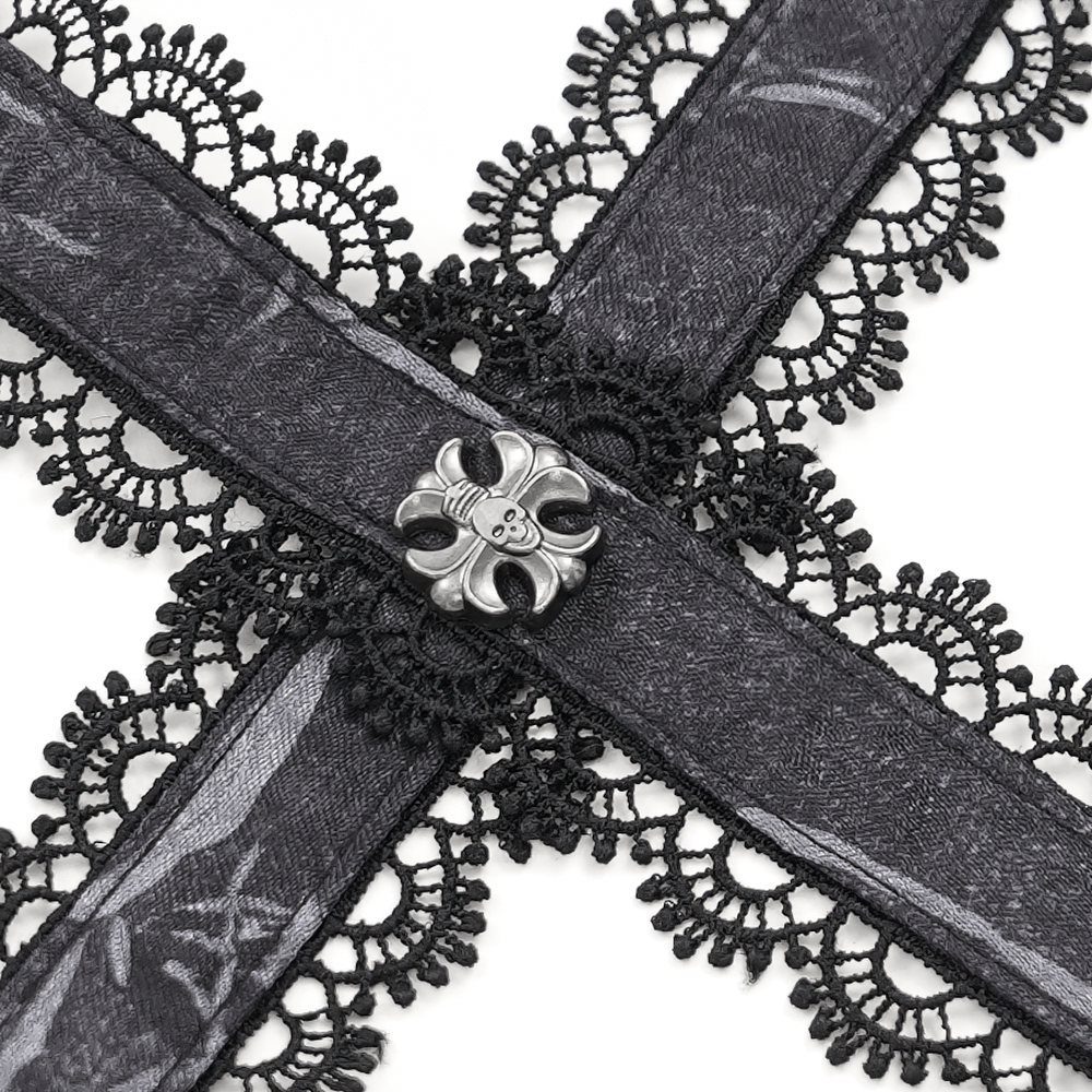 Close-up of black lace trim and cross pendant detail on an elegant gothic corset.
