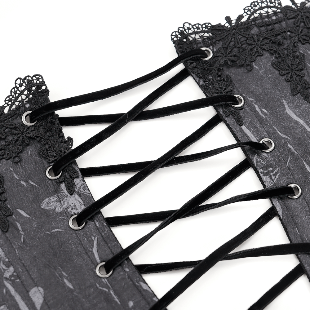 Close-up of the lace-up back of an elegant gothic corset featuring black lace trim and intricate details.