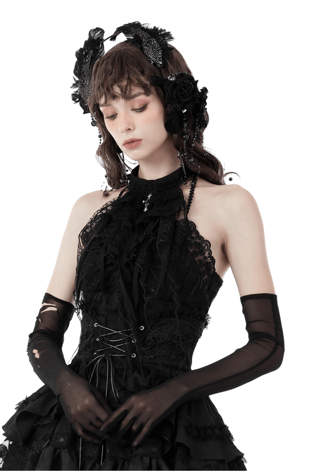 Elegant gothic model wearing a black lace camisole with intricate details and accessories, embodying dark romantic style.