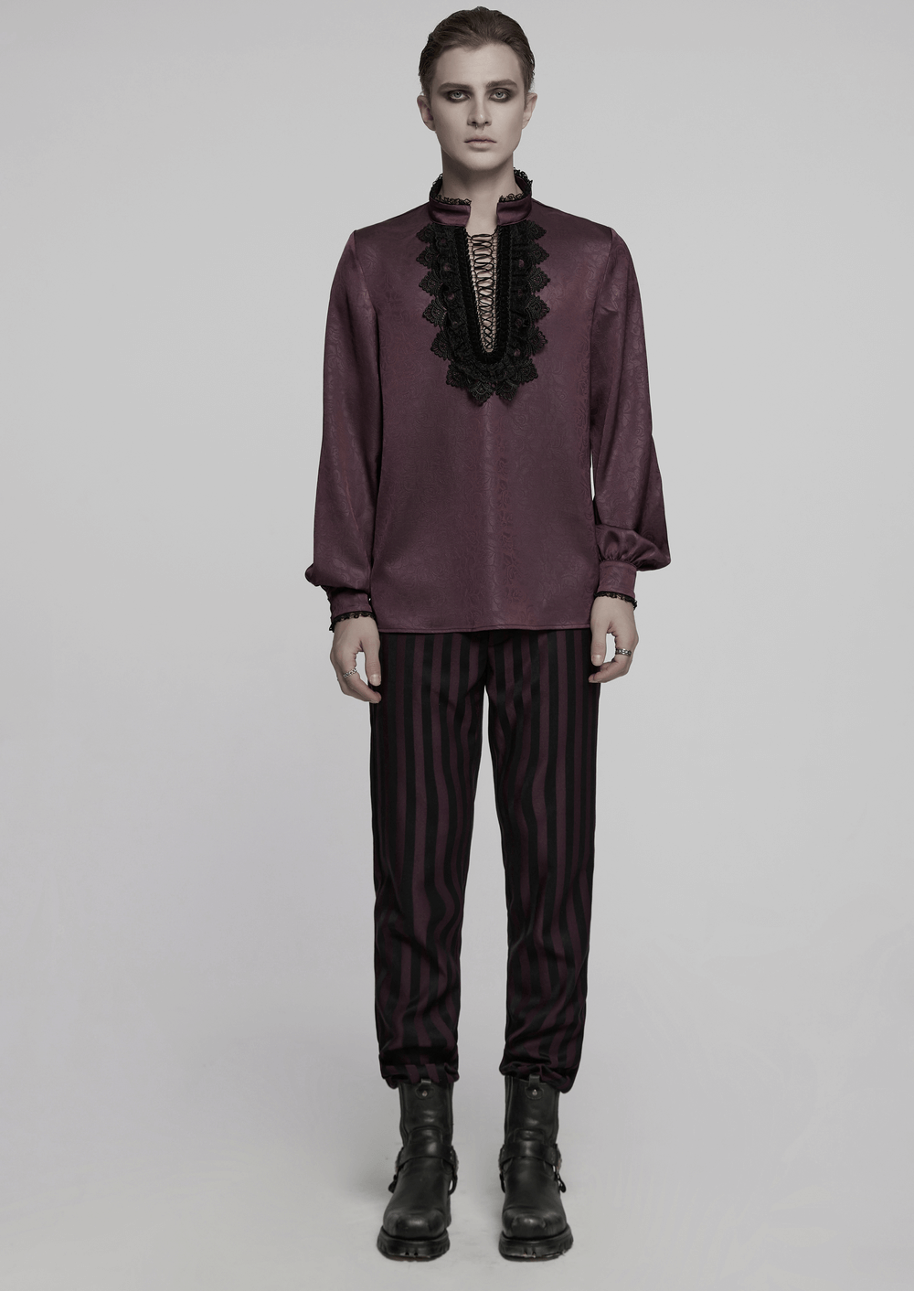 Elegant gothic lace detail shirt with stand-up collar and drawstring, paired with striped pants for a refined gothic look.
