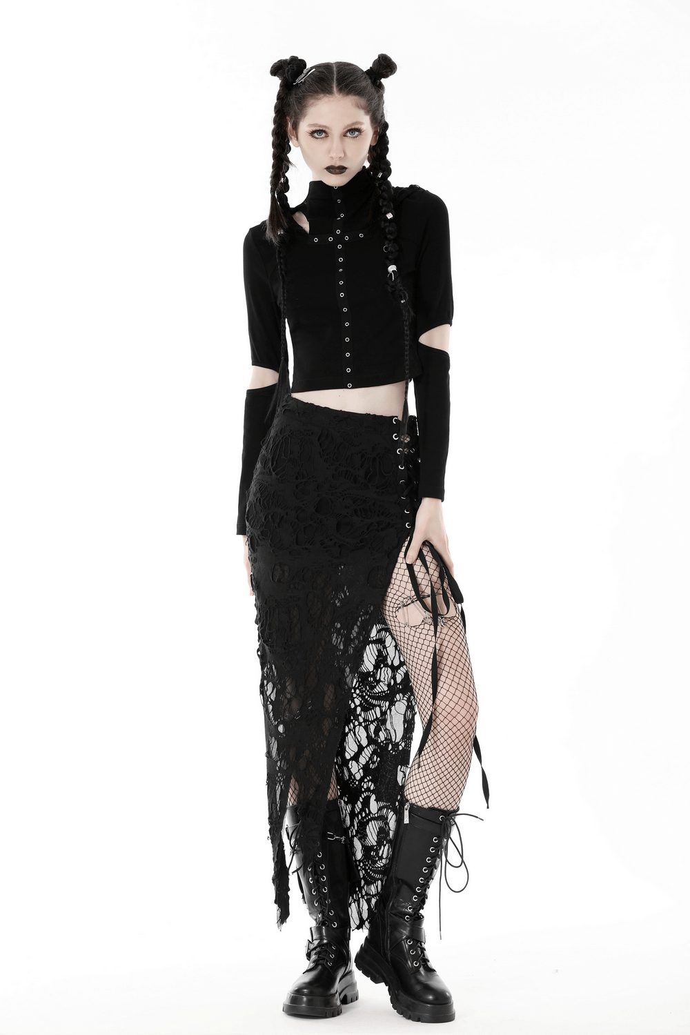 Gothic fashion model in lace detailed side-laced long skirt with fishnet and combat boots, showcasing edgy style.