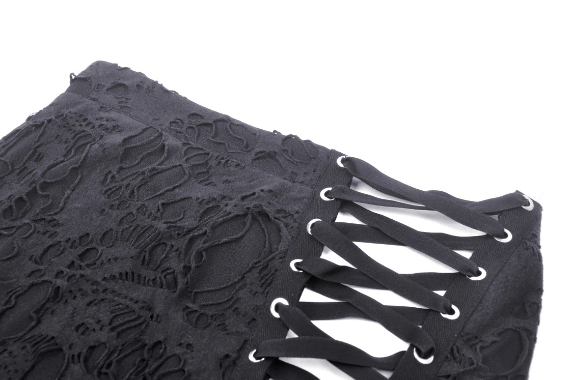 Close-up of elegant black gothic lace skirt with intricate side lacing details for edgy fashion statements.