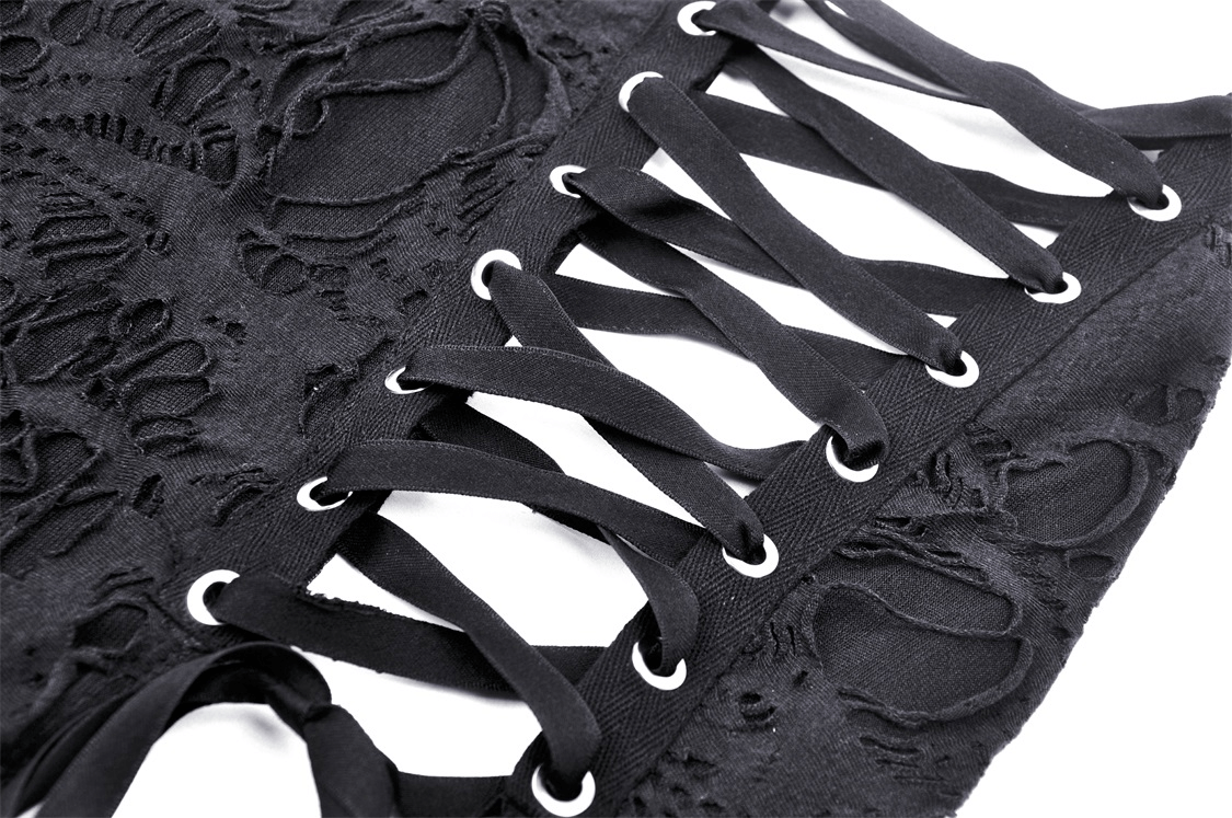 Close-up of intricate black lace detailing and side lacing on an elegant gothic long skirt.