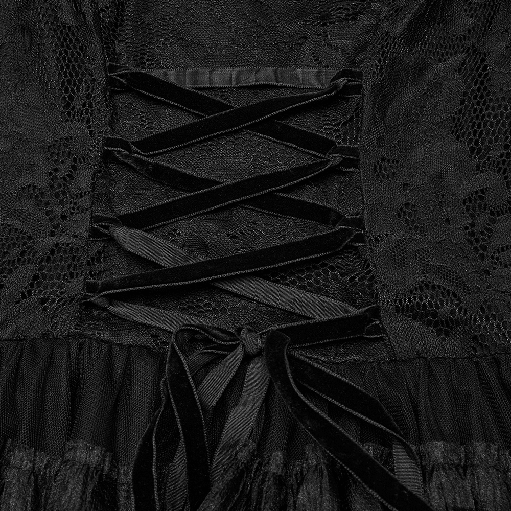Close-up of elegant Gothic lace dress with intricate lace-up detailing and soft ruffled chiffon layers.
