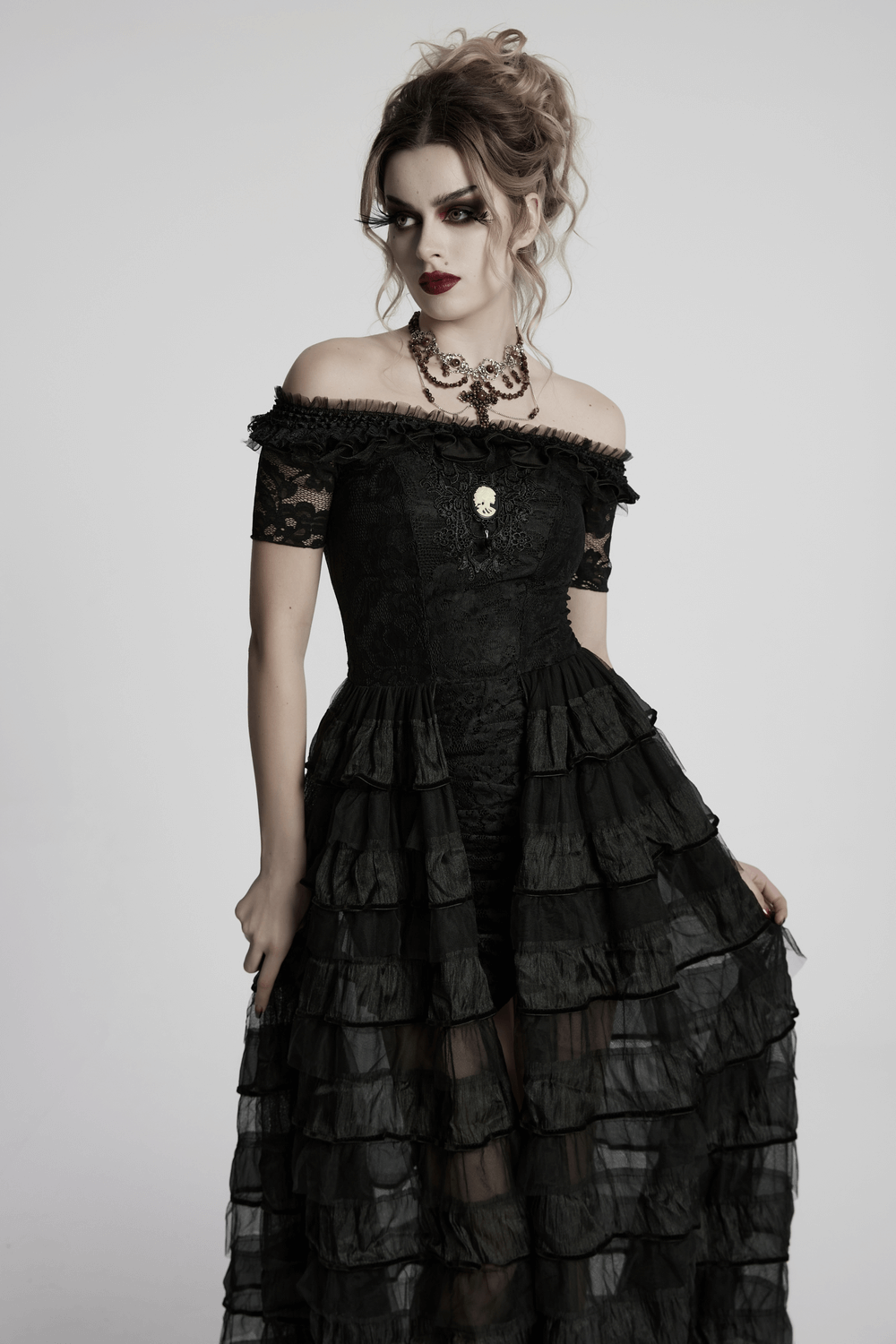 Elegant Gothic lace dress with ruffled chiffon layers, perfect for a dramatic and stylish look.