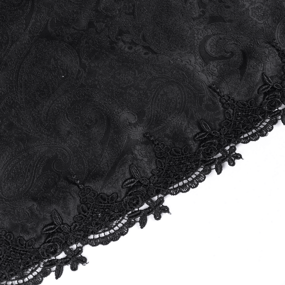 Elegant black lace trim with intricate floral patterns on dark fabric, perfect for gothic fashion accents.