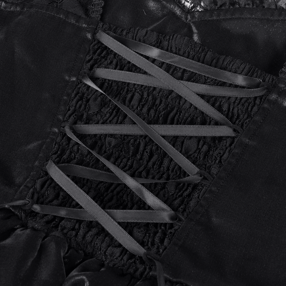 Close-up of the corset-inspired lace-up back detail on a gothic lace dress with elegant black ribbons.