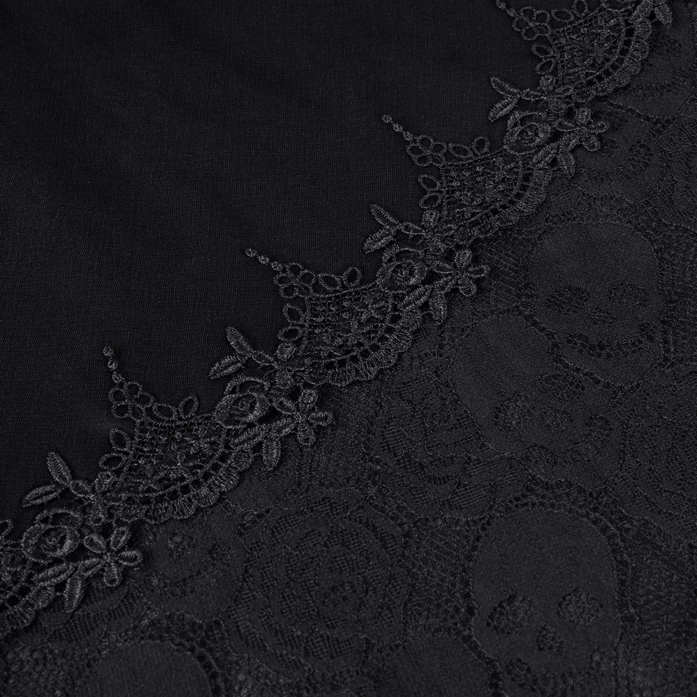 Close-up of elegant black lace featuring intricate skull patterns and floral designs, perfect for gothic fashion.