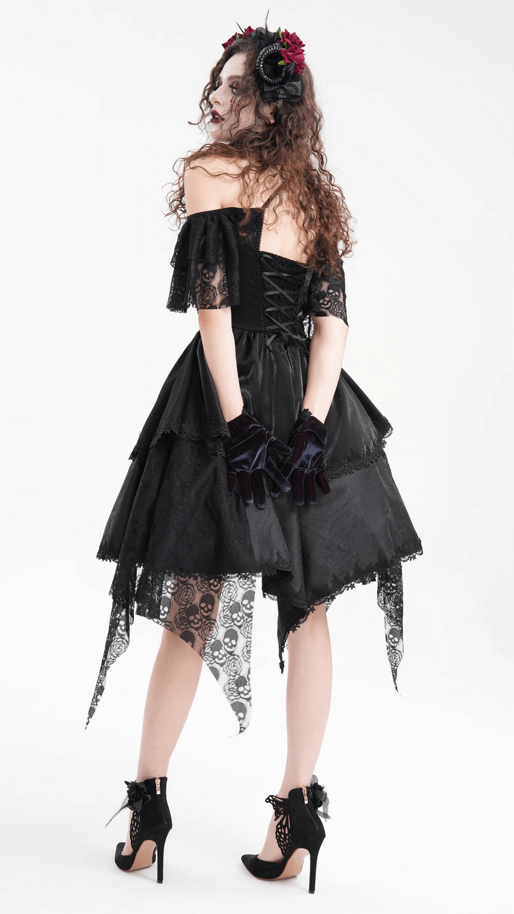 Elegant gothic lace dress with skulls, tiered layers, and corset back, showcasing dark elegance. Perfect for spooky occasions.