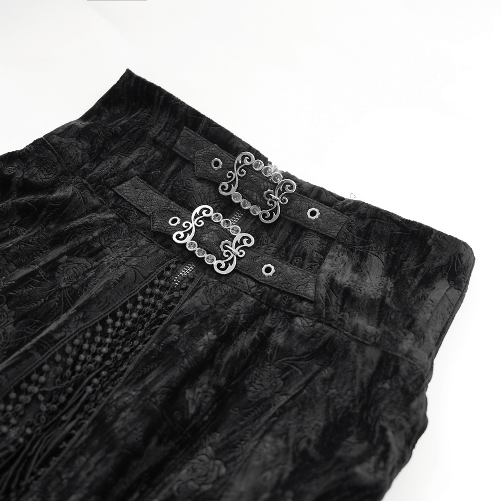 Close-up of gothic lace skirt waistband with ornate corset-style clasps and tassel detailing.