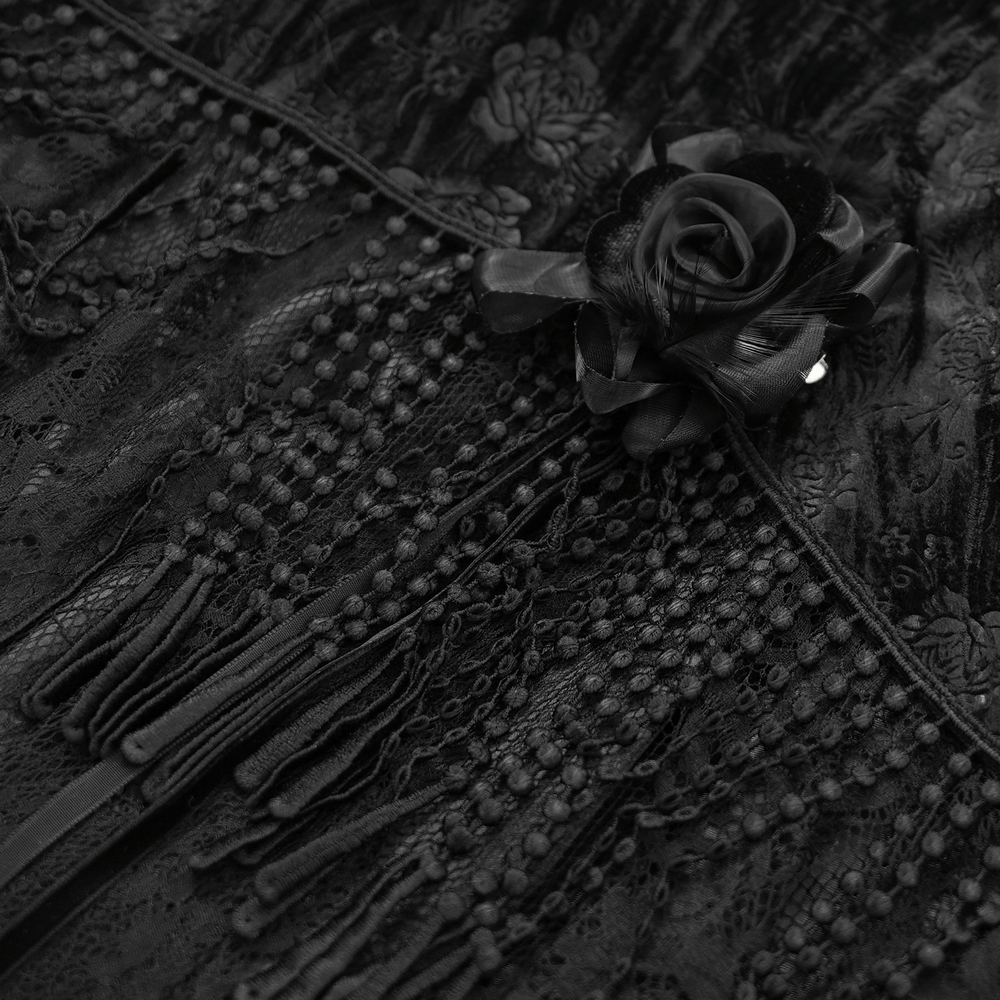Elegant black lace skirt featuring floral embroidery, dramatic tassels, and a gorgeous rose detail.