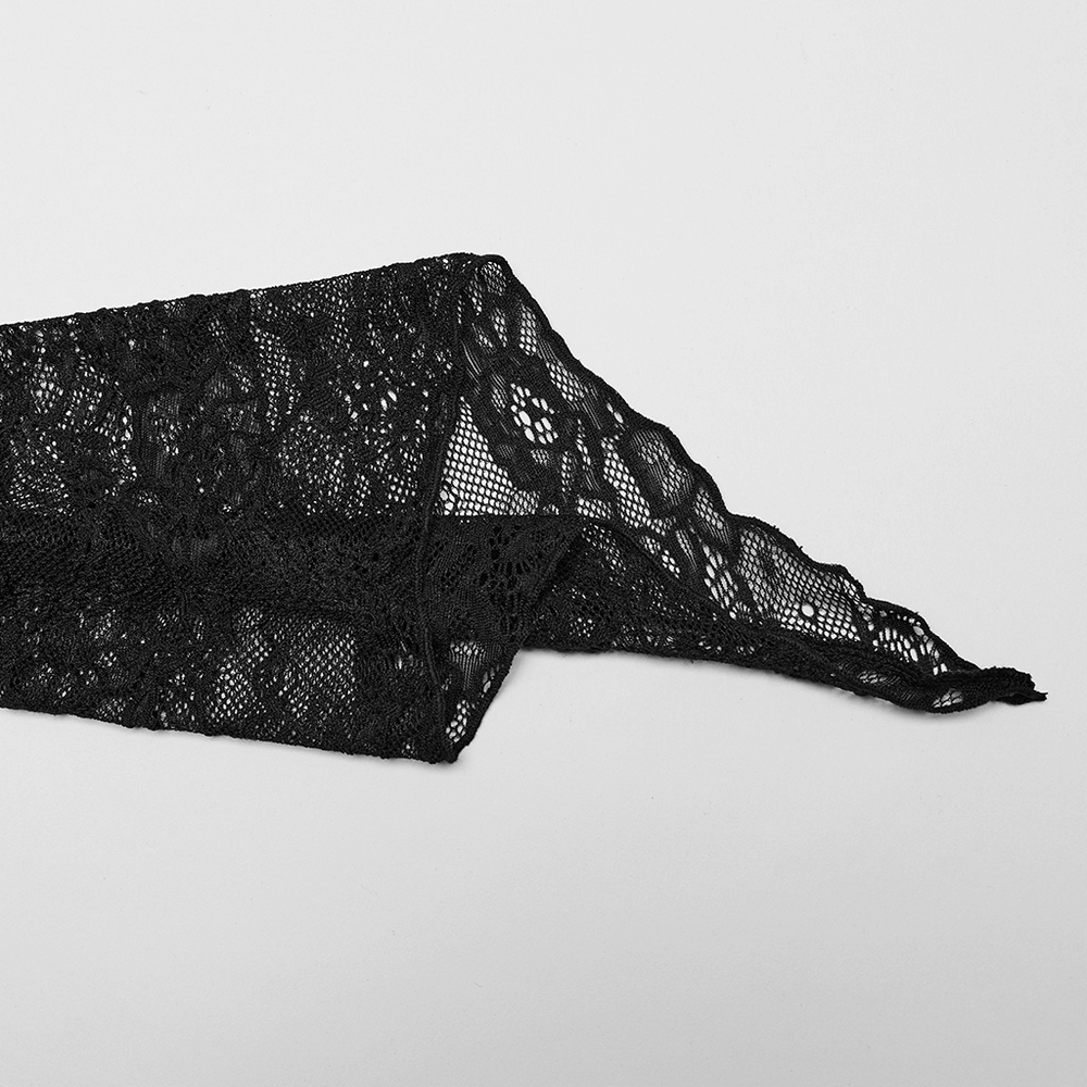 Elegant black lace fabric showcasing intricate patterns, perfect for gothic and formal attire.