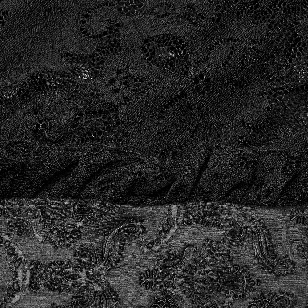 Close-up of elegant black lace fabric and patterned fabric, showcasing dark elegance in a Victorian-inspired design.