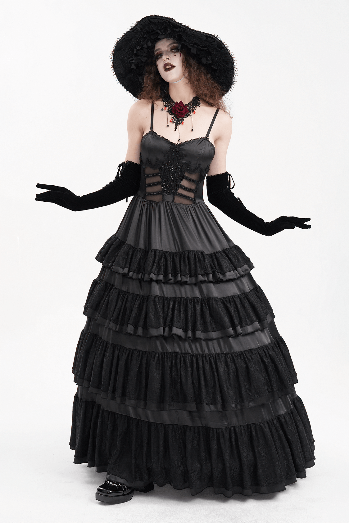 Victorian-inspired black lace maxi dress with ruffles, perfect for gothic events, featuring a strappy design and dramatic layers.