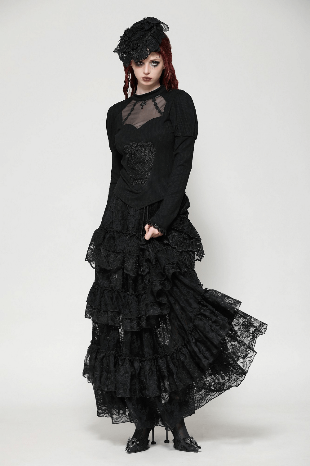 Elegant Gothic lace top with Victorian design, model showcasing dark, ruffled skirt and unique headpiece for a dramatic look.