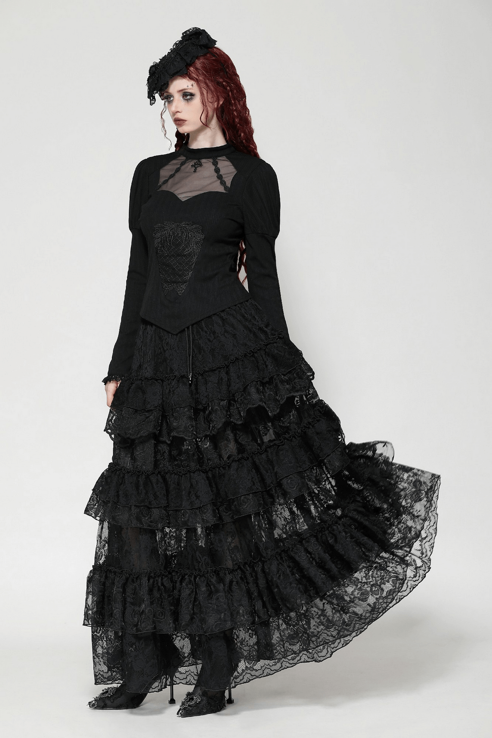 Elegant gothic lace top with Victorian design, long puffed sleeves, and a stunning layered black lace skirt. Perfect for gothic styling.