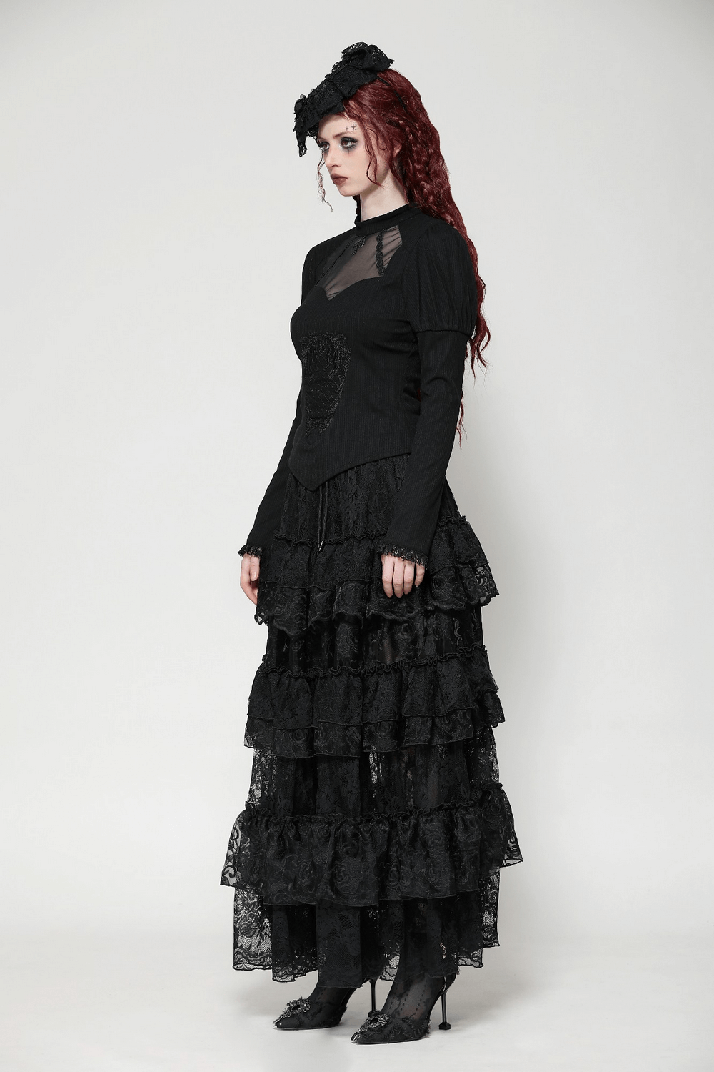 Elegant gothic lace top paired with a dramatic tiered black skirt, showcasing Victorian-inspired fashion and dark elegance.