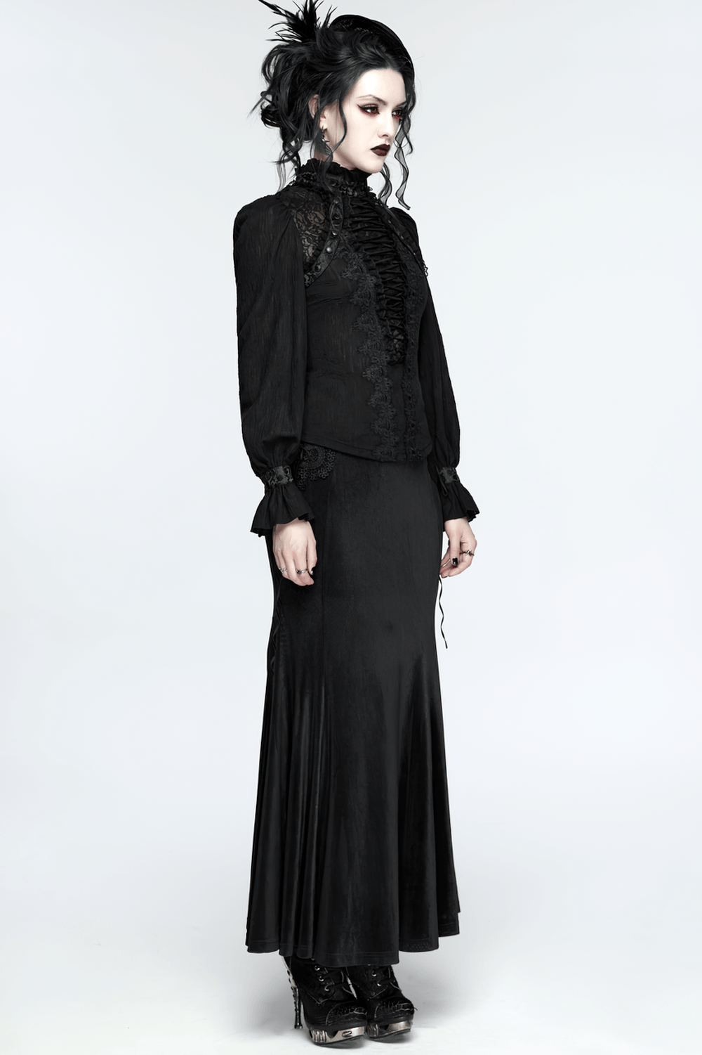 Alt Tag: Elegant Gothic Lace-Up Vampire Blouse With Flared Cuffs on model, black lace-up gothic blouse with dramatic flared cuffs