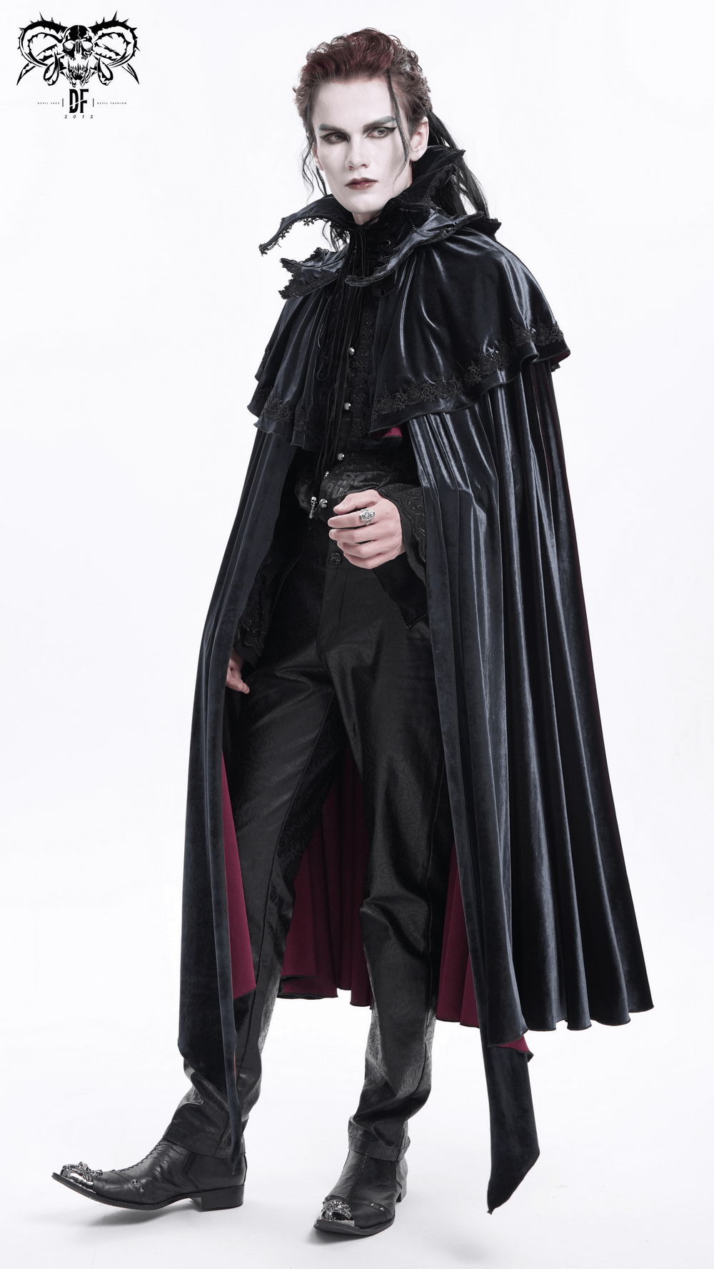 Elegant vampire in a dramatic black velvet cape, showcasing gothic attire and a dark aesthetic. Perfect for cosplay or themed events.