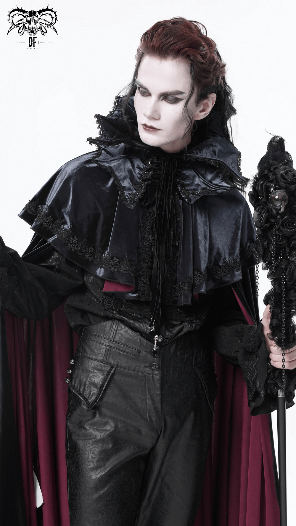 Elegant gothic vampire in a velvet lace collar, showcasing dramatic dark attire and a regal cape. Perfect for dark aesthetics.