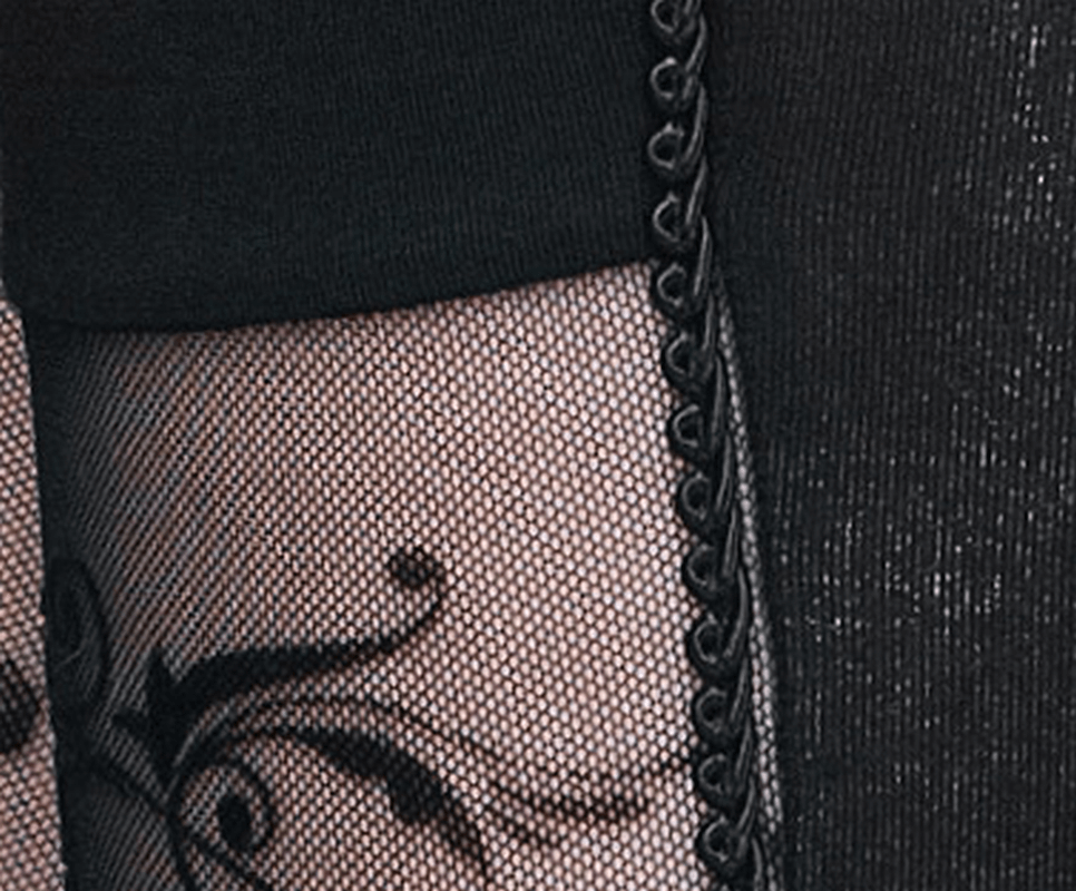 Close-up of elegant gothic leggings featuring baroque patterns and stylish transparent inserts for a chic look.