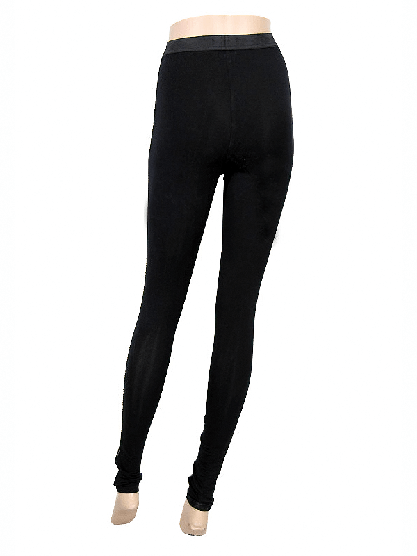 Elegant black gothic leggings with baroque patterns, featuring a form-fitting cut and stylish transparent inserts.