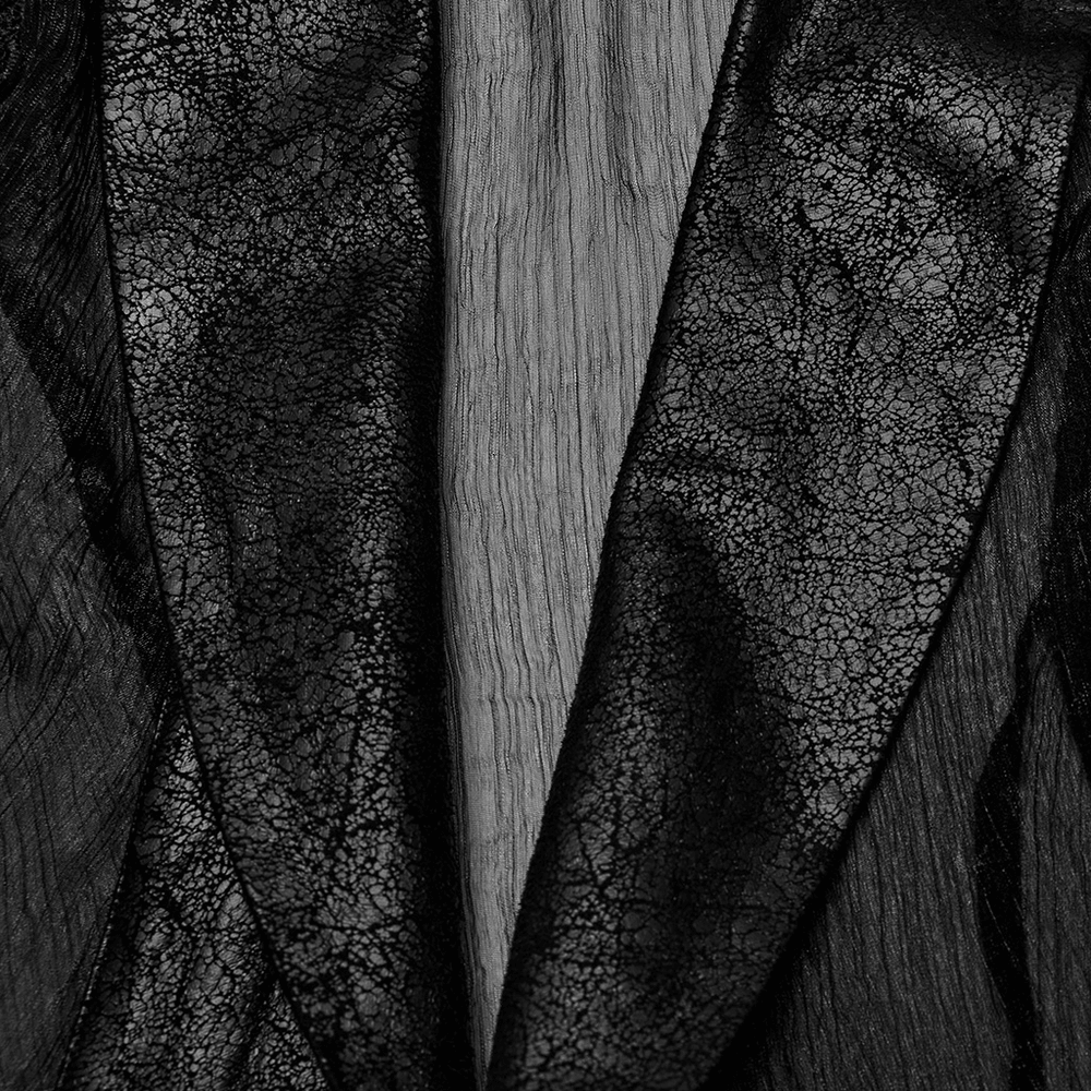 Close-up of cracked black PU leather and chiffon fabric of an elegant Gothic cape.