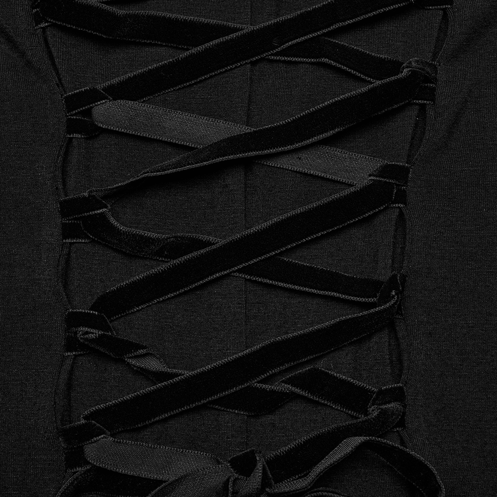 Detailed view of lace-up design with black ribbons on elegant gothic dress.