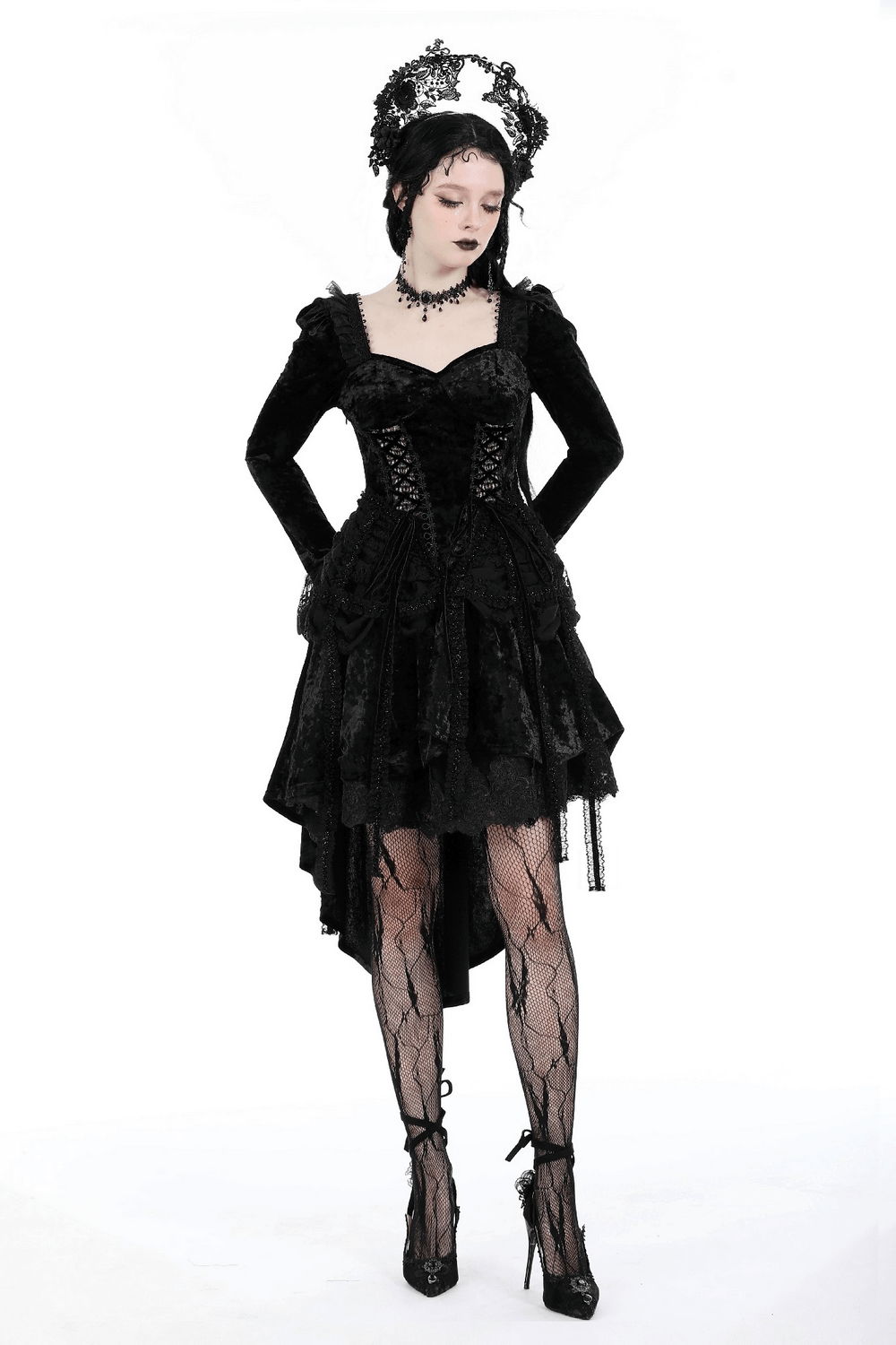 Elegant Gothic black velvet dress with lace sleeves and high-low skirt, perfect for dramatic nights out.
