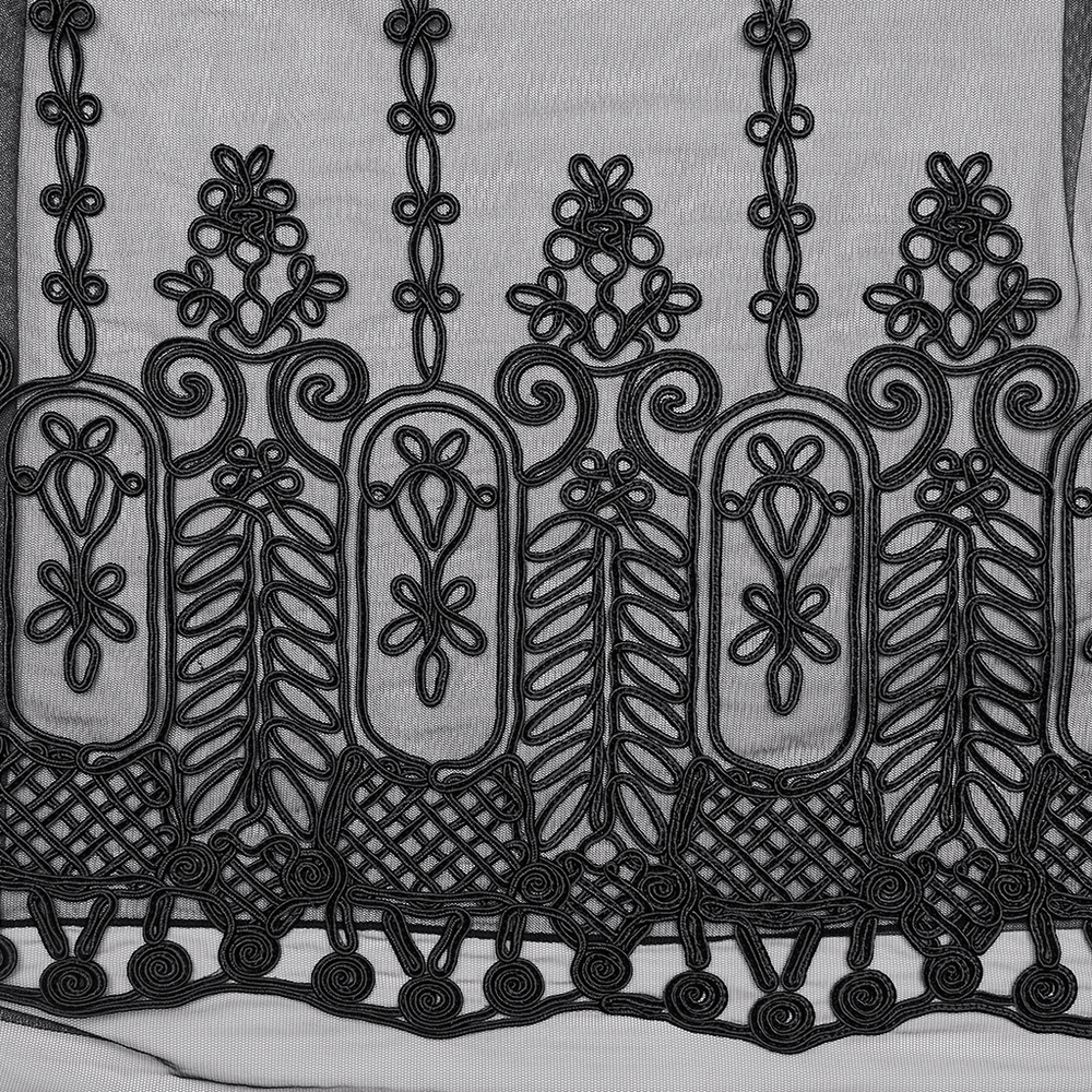 Intricate black 3D floral embroidery on sheer mesh fabric, showcasing gothic elegance and detailed craftsmanship.