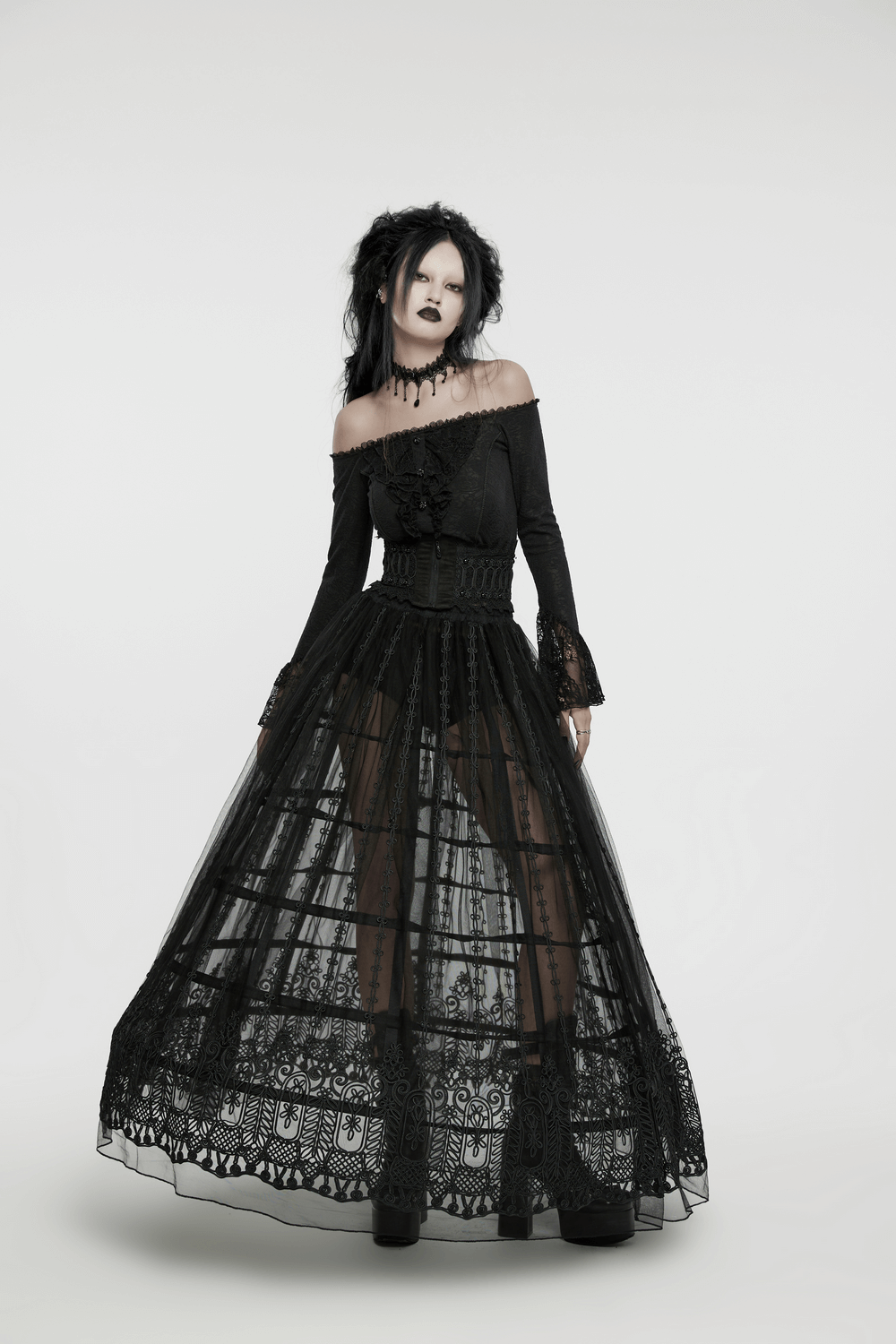 Elegant gothic model in a black 3D floral embroidered maxi skirt and off-shoulder top, exuding dark romance.