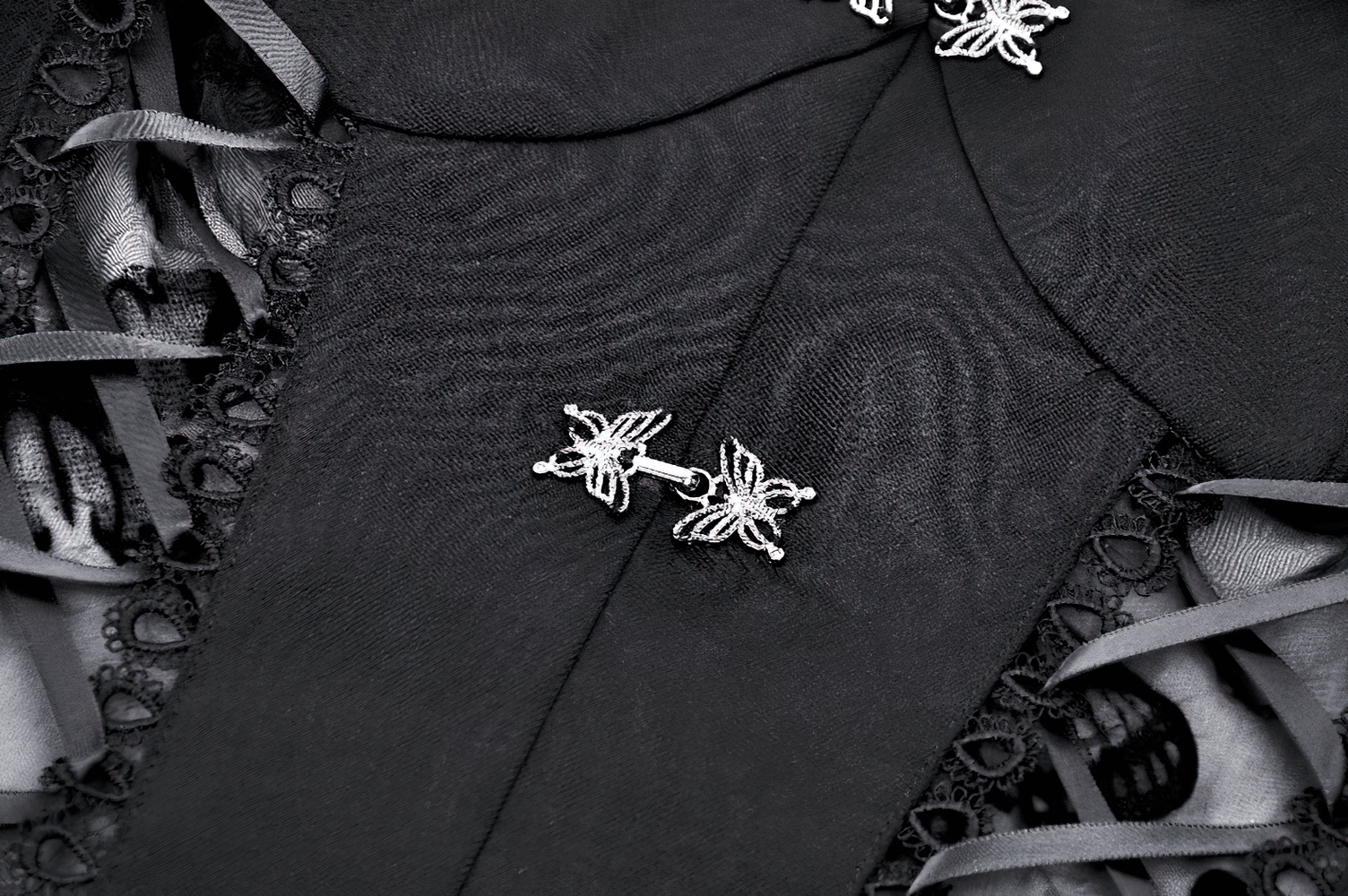 Close-up of the Elegant Gothic Mini Dress showcasing intricate butterfly accents and lace details.