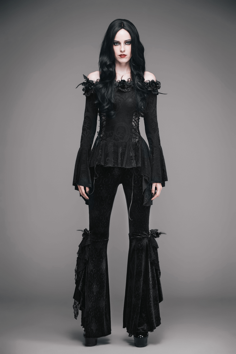 Gothic women's black top with lace-up and flared sleeves, styled with feather details and a unique cut.