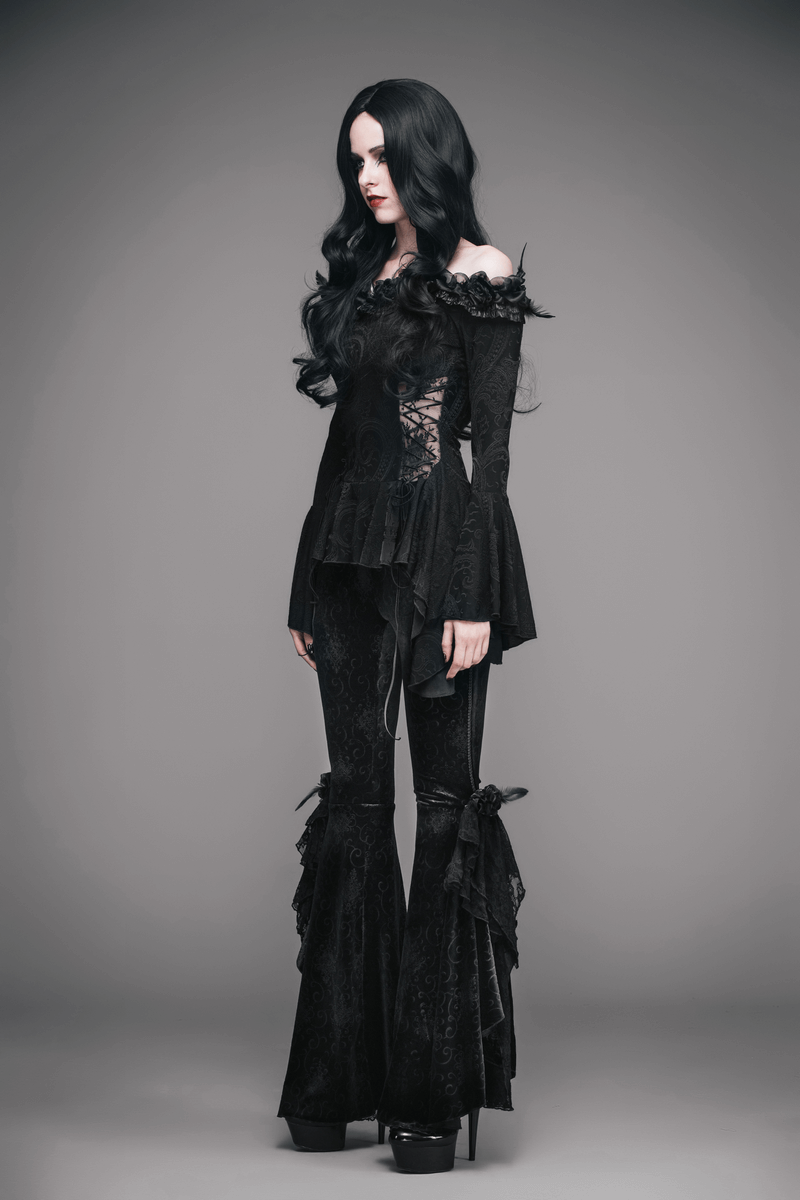 Elegant gothic black top with lace-up and feathers, paired with stylish flared pants, showcasing a stunning look.