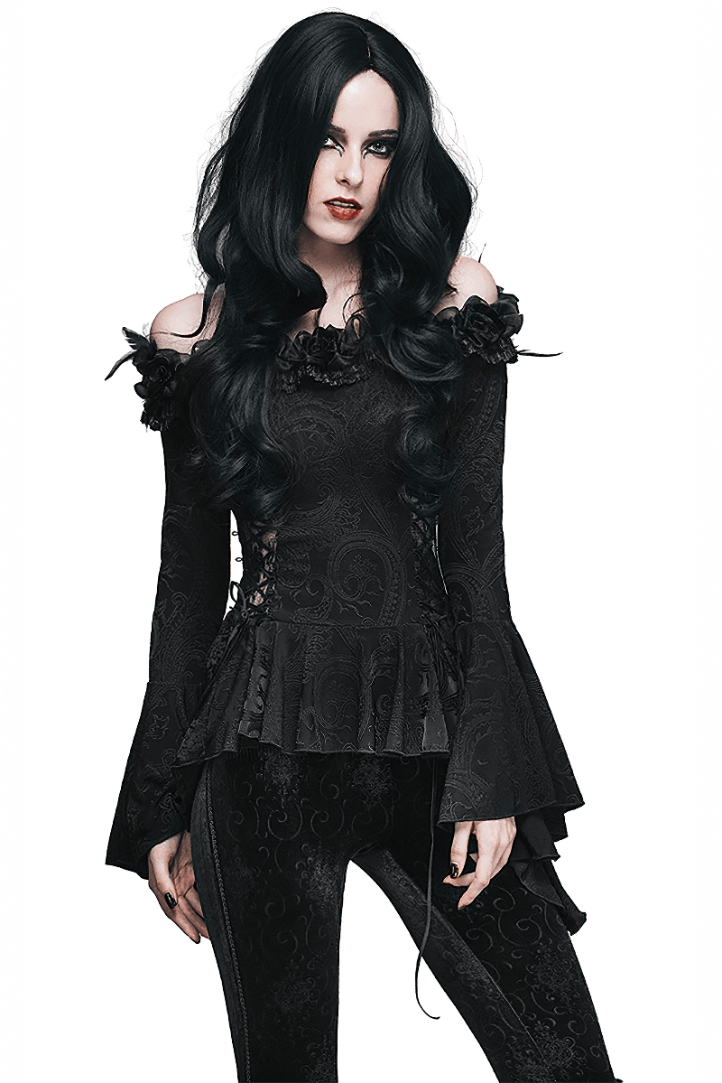 Elegant gothic black top with flared sleeves and floral accents, perfect for a stylish gothic look.