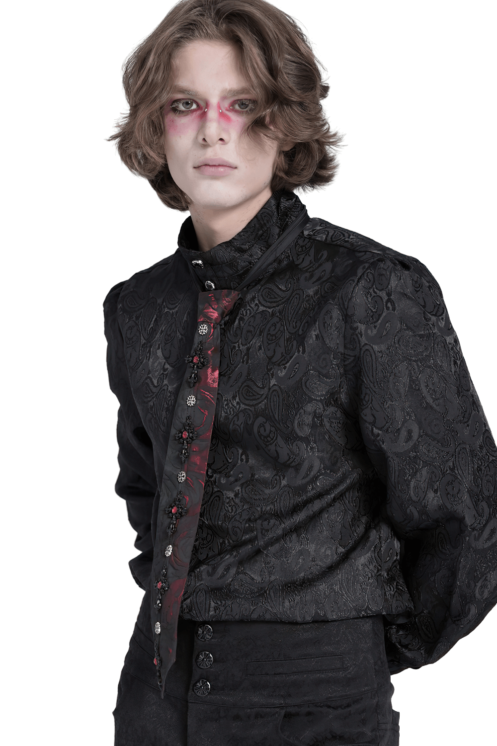 Gothic model in textured black shirt showcasing a stylish red-black floral crystal tie for alternative fashion looks.