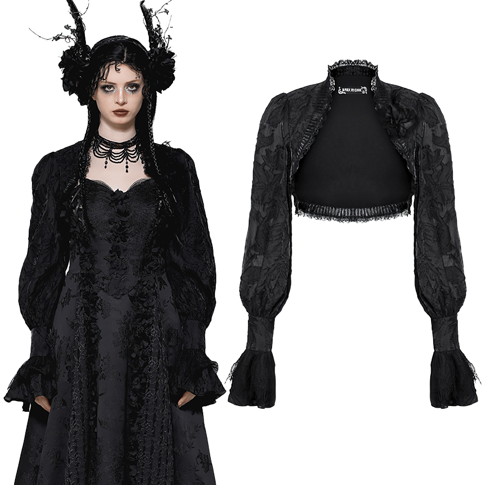 Elegant black Gothic bolero with fringe sleeves, lace accents, and floral pattern, worn with a matching dress.