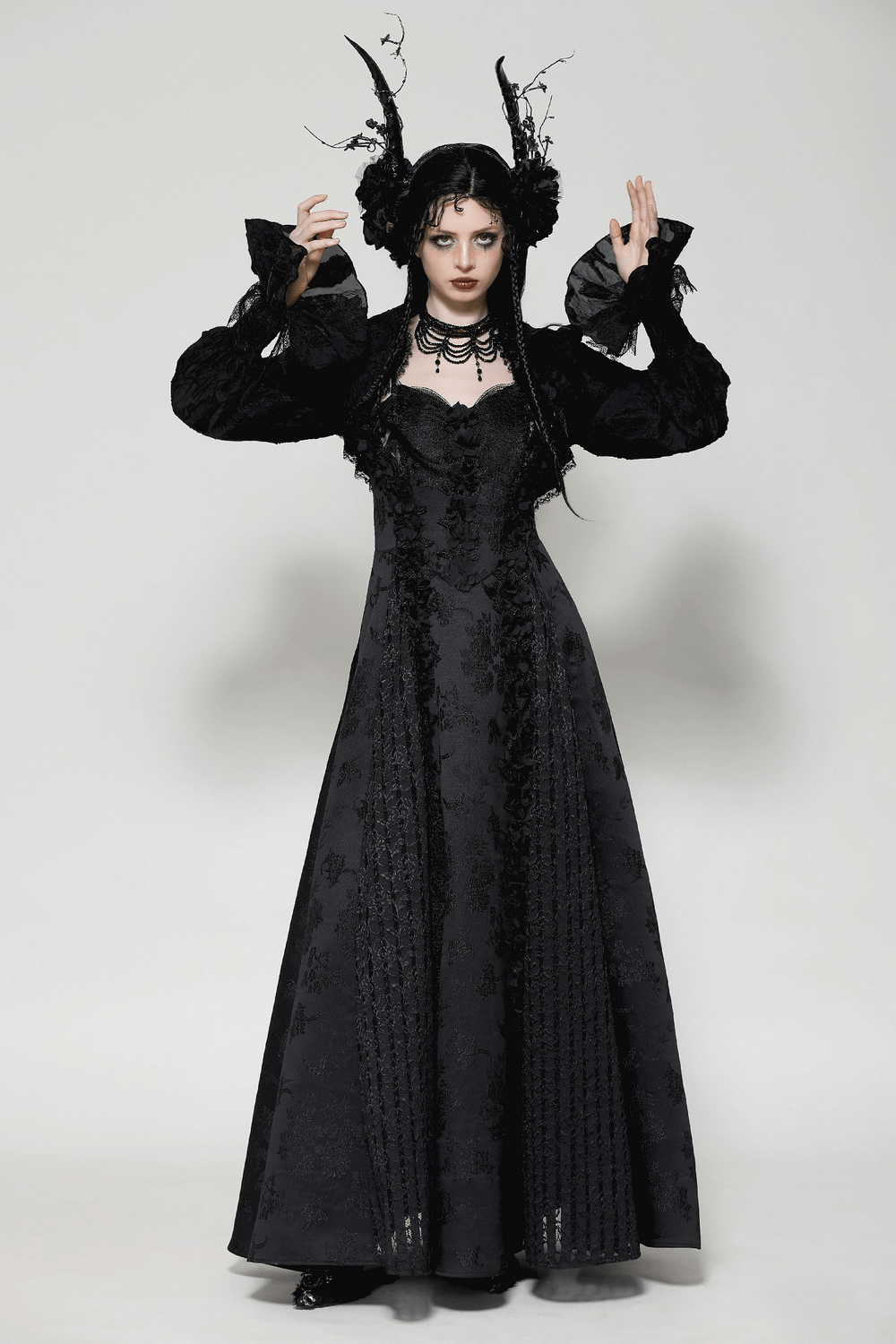 Elegant gothic dress with ruffled sleeves and floral pattern, perfect for a striking Victorian style.