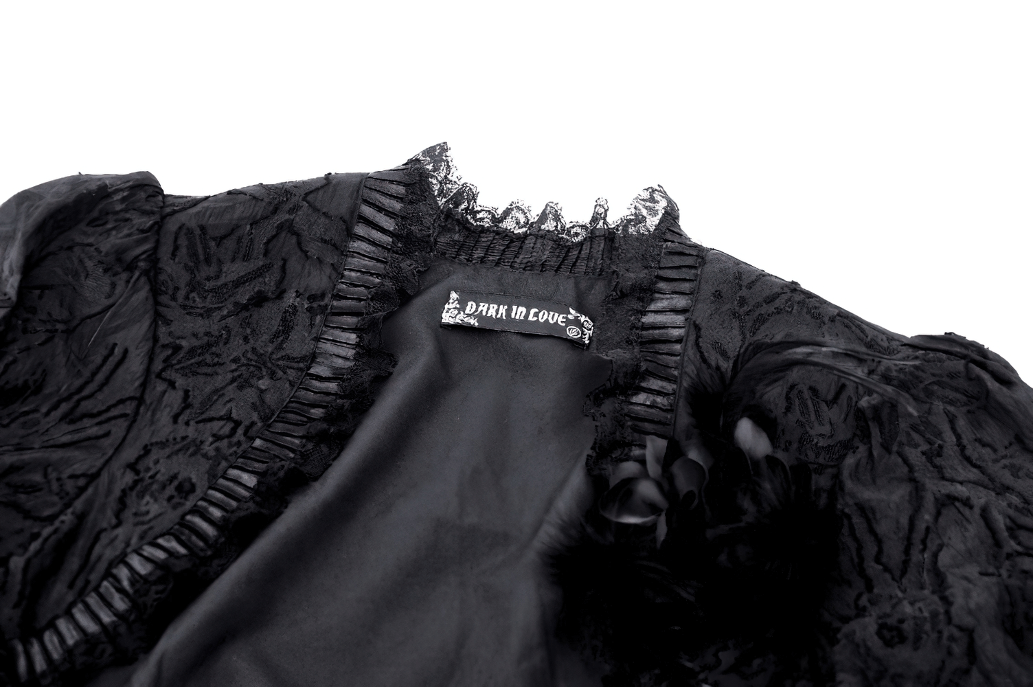 Elegant black gothic bolero with lace and ruffled detailing, showcasing intricate floral patterns and fringe sleeves.