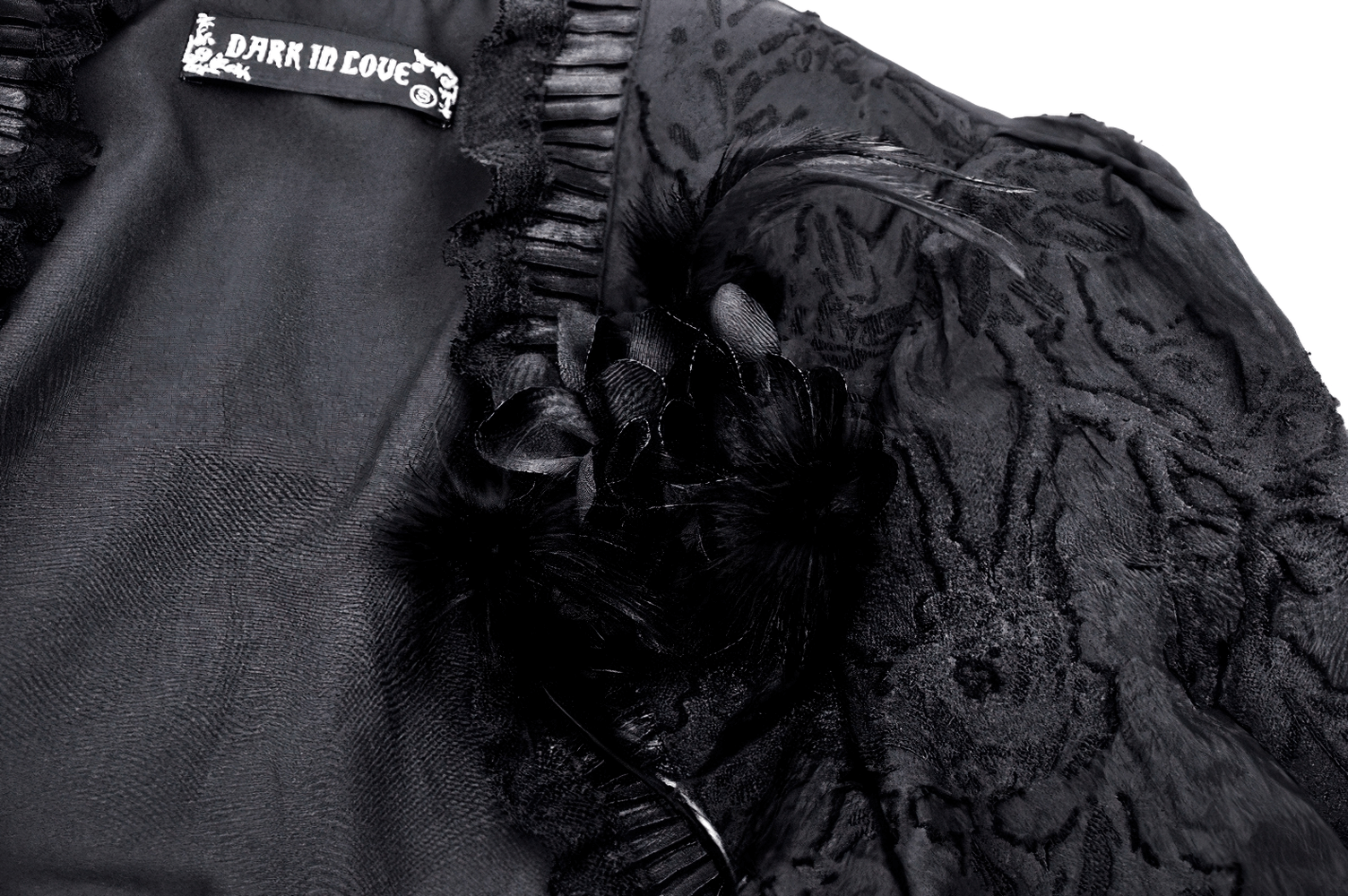 Elegant black Victorian bolero interior featuring lace details and floral accents for a gothic style.