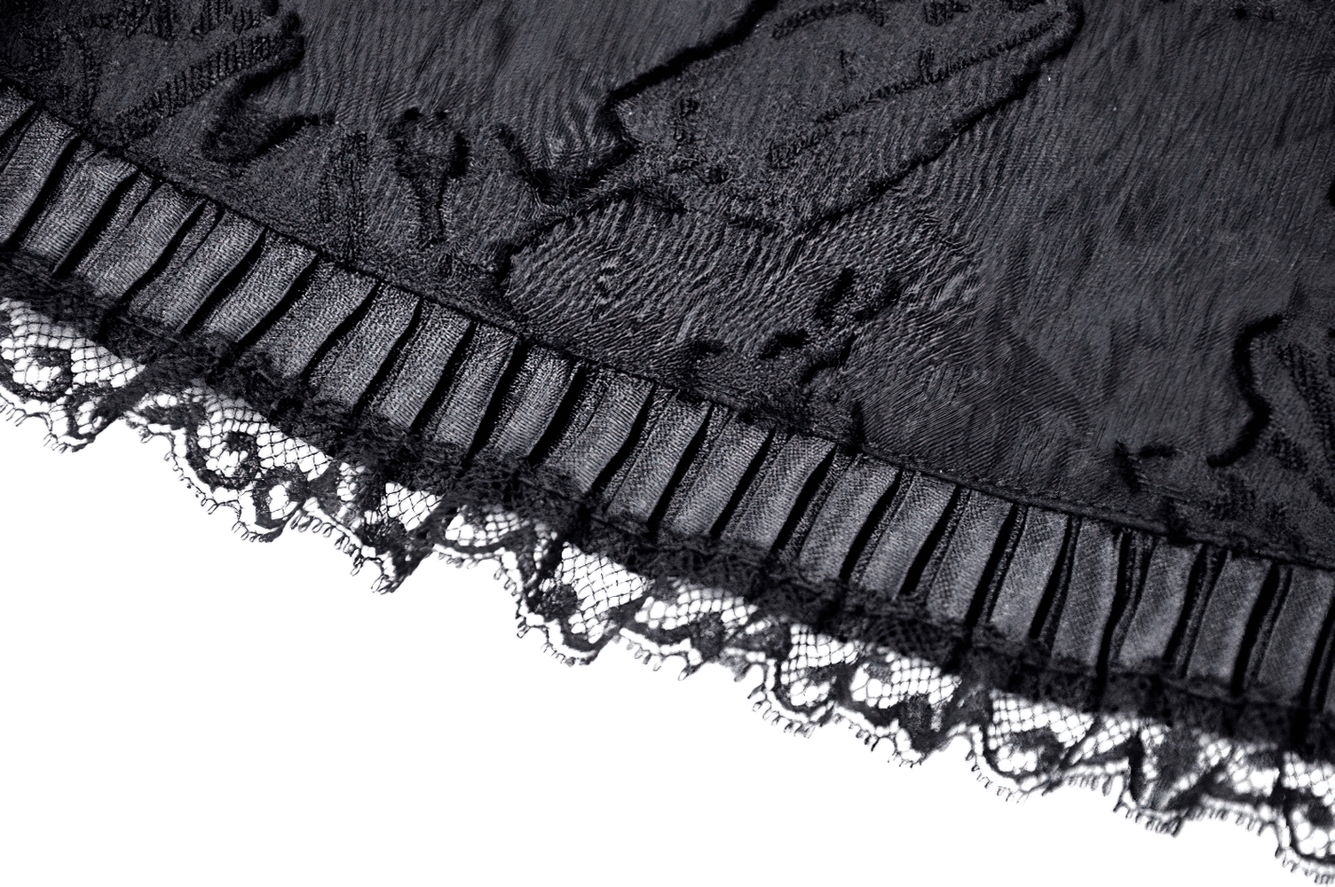 Elegant black lace fabric with ruffles and fringed detailing, perfect for gothic fashion.