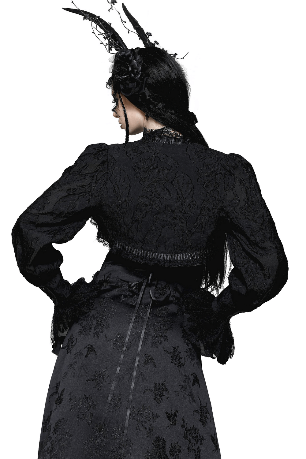 Elegant black gothic bolero with lace details and ruffled sleeves, showcasing a stunning floral pattern from the back.