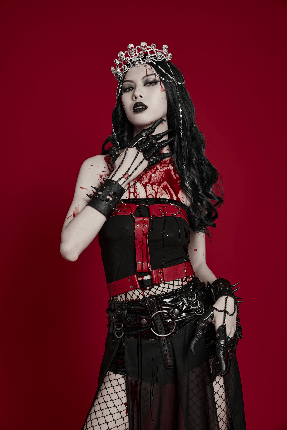 Model wearing Elegant Gothic Skull Tiara, styled with red and black attire, showcasing a dramatic gothic look.