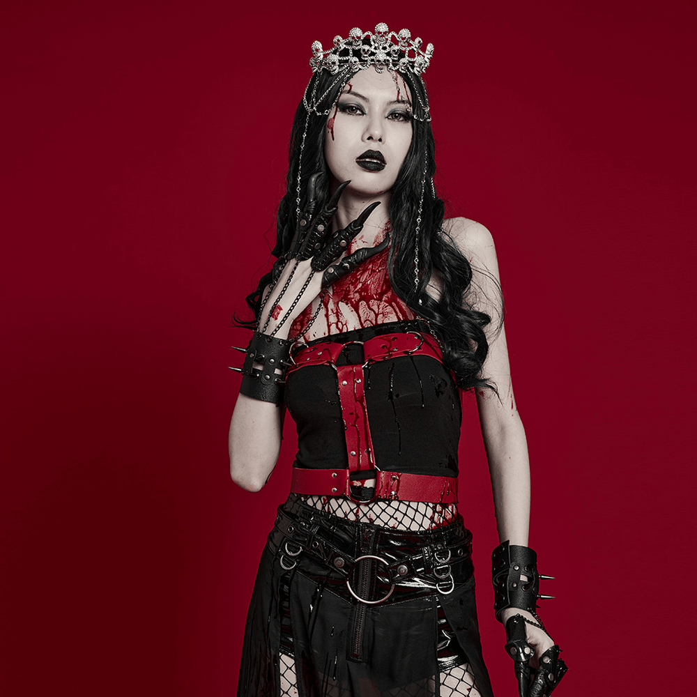 Gothic model wearing an Elegant Skull Tiara with chains, styled in dark, edgy fashion against a red backdrop.
