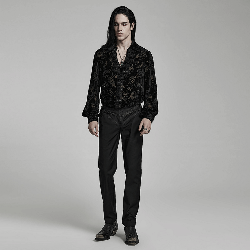 Stylish model in Gothic slim-fit jacquard pants and black shirt, showcasing gothic elegance and unique lace detailing.