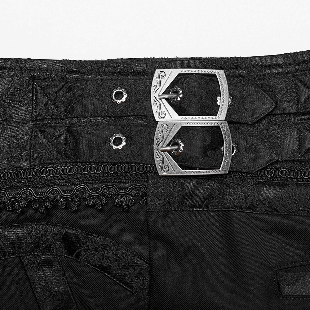 Close-up of intricate Gothic-style buckles and lace detail on designer slim-fit jacquard trousers.